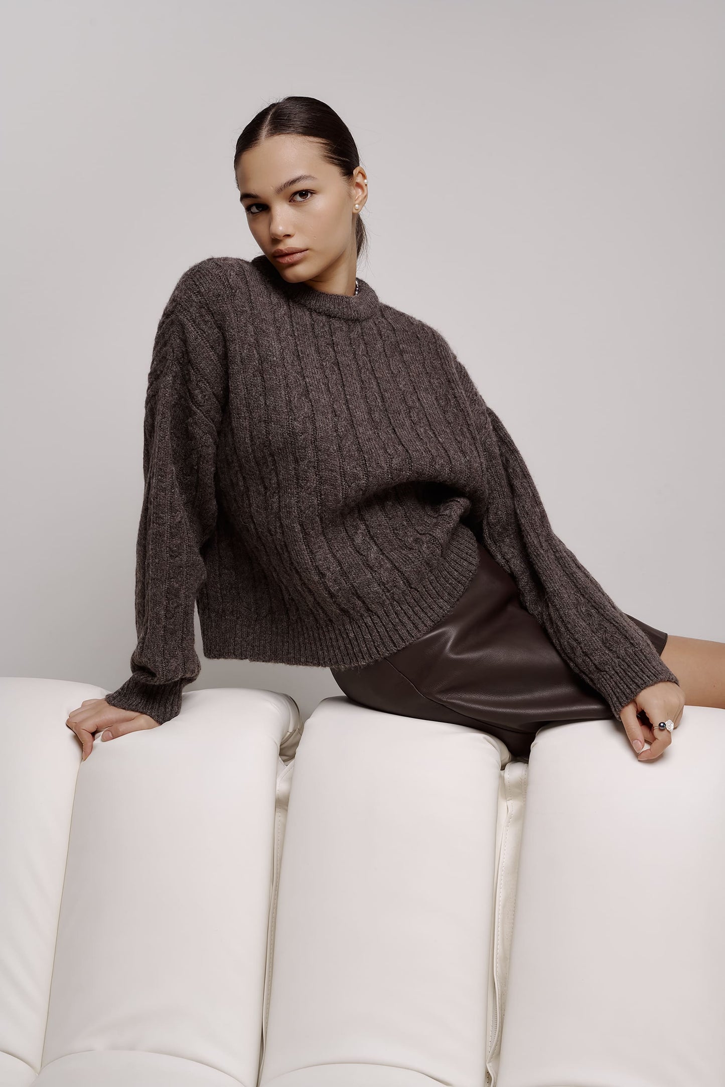 Wool sweater with pigtails