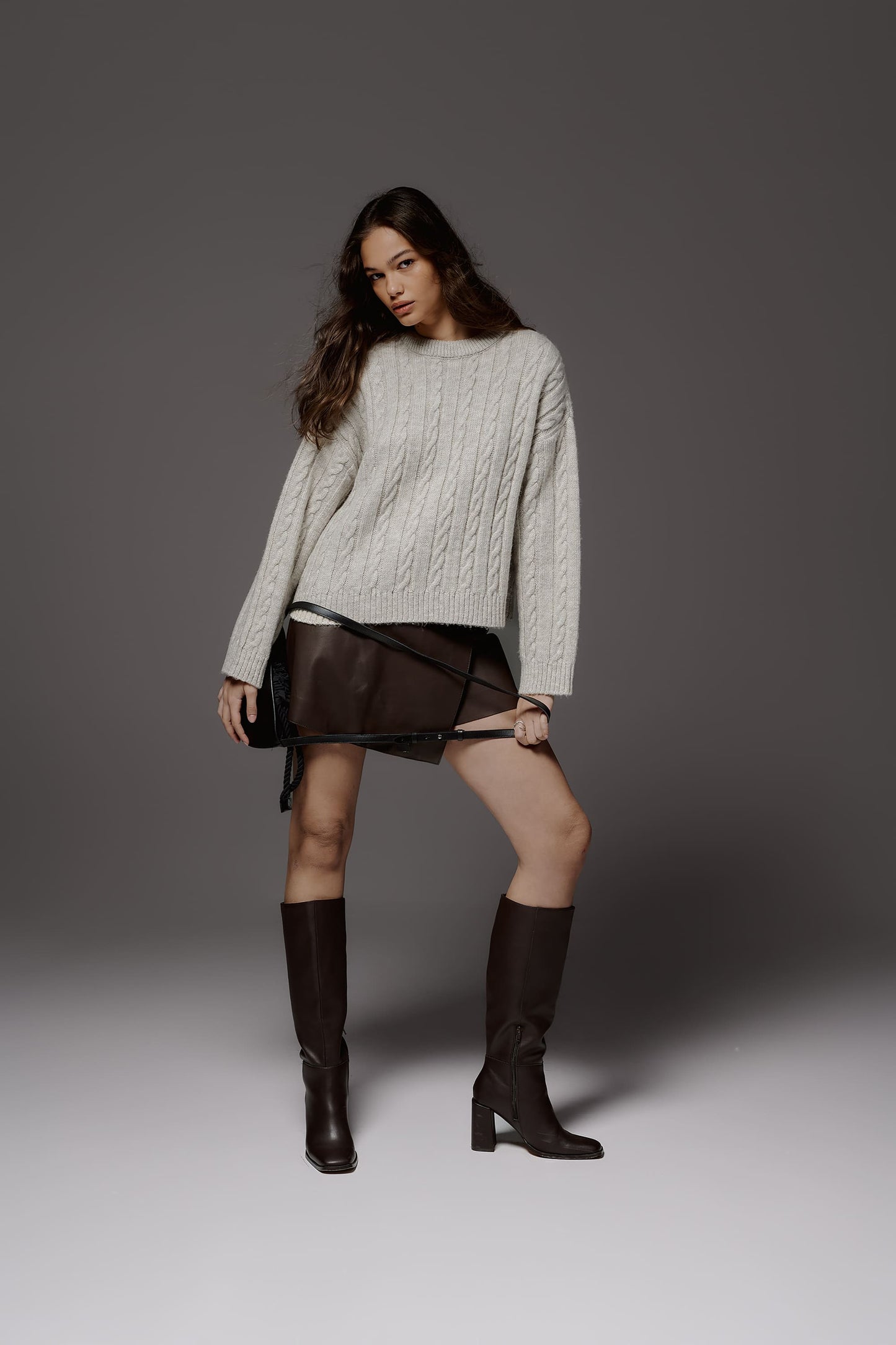 Wool sweater with pigtails