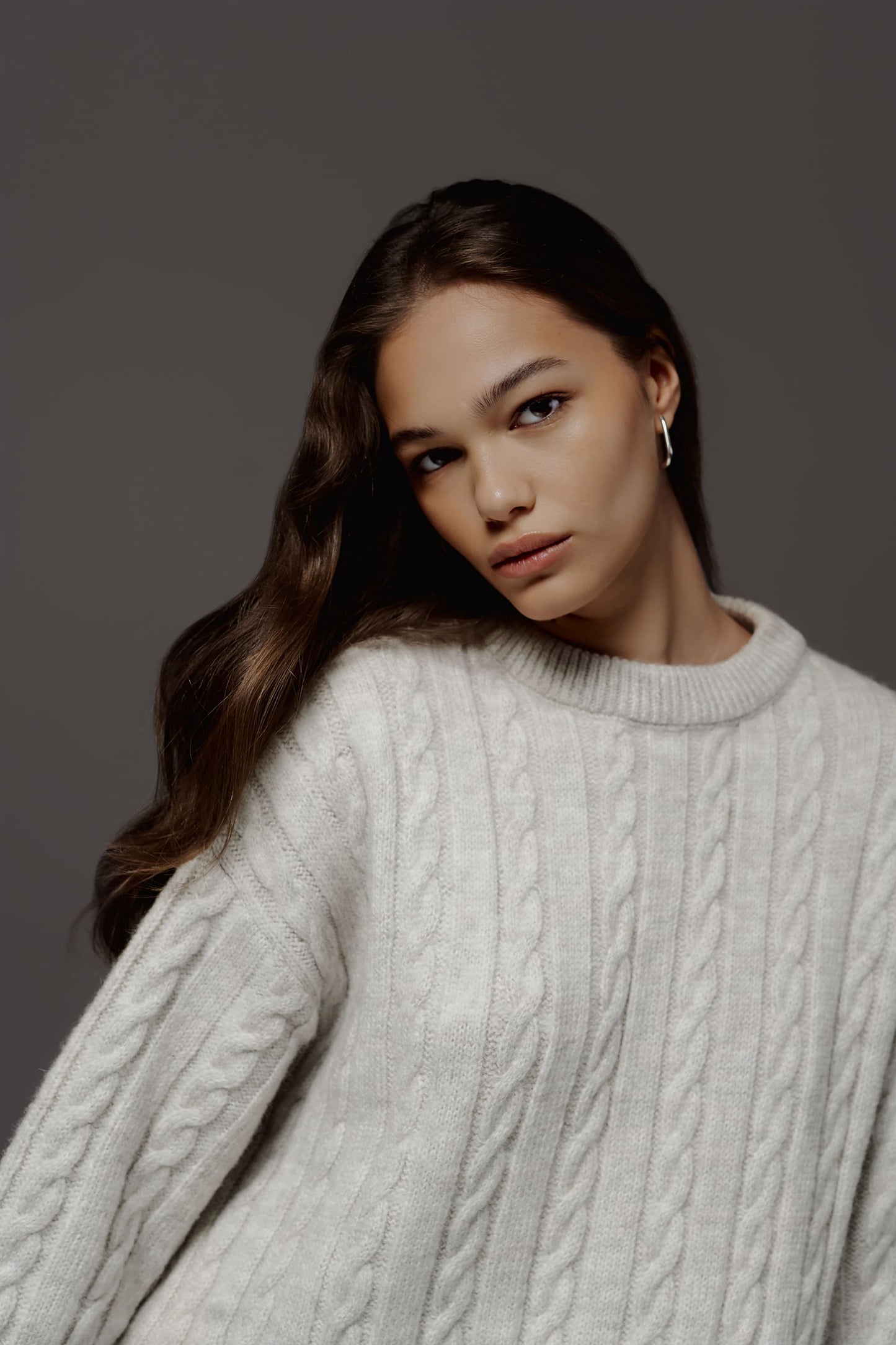 Wool sweater with pigtails