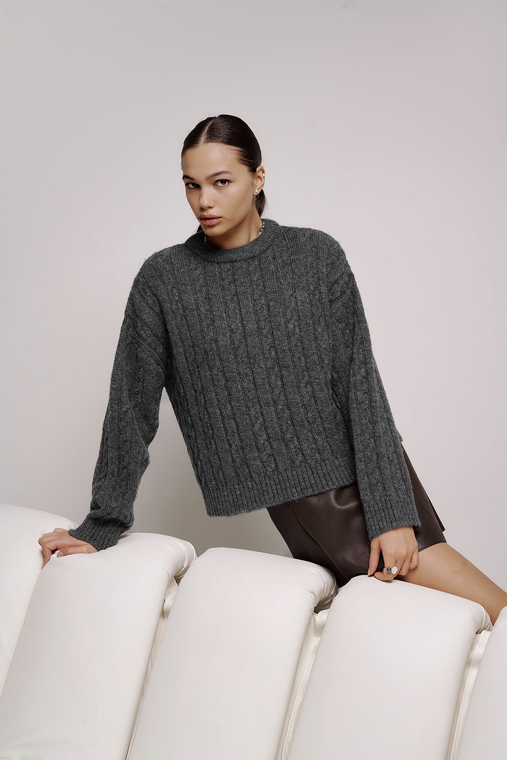 Wool sweater with pigtails